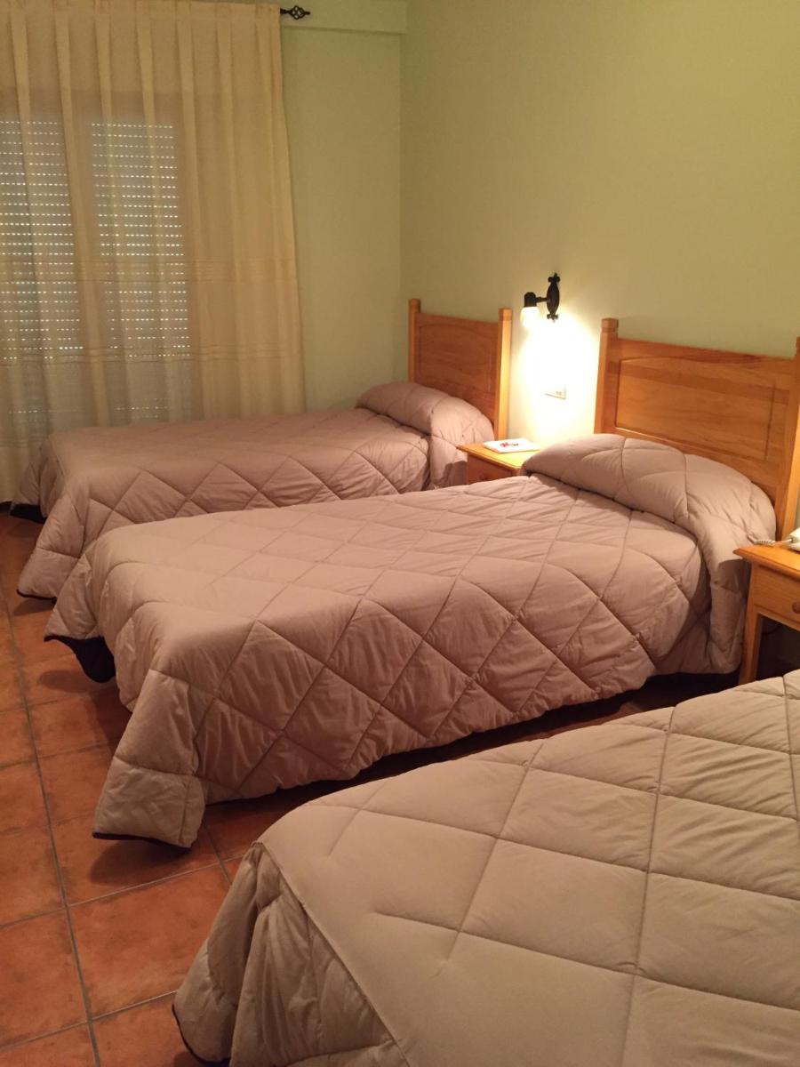 Cama o camas de una habitación en Hotel Castellote