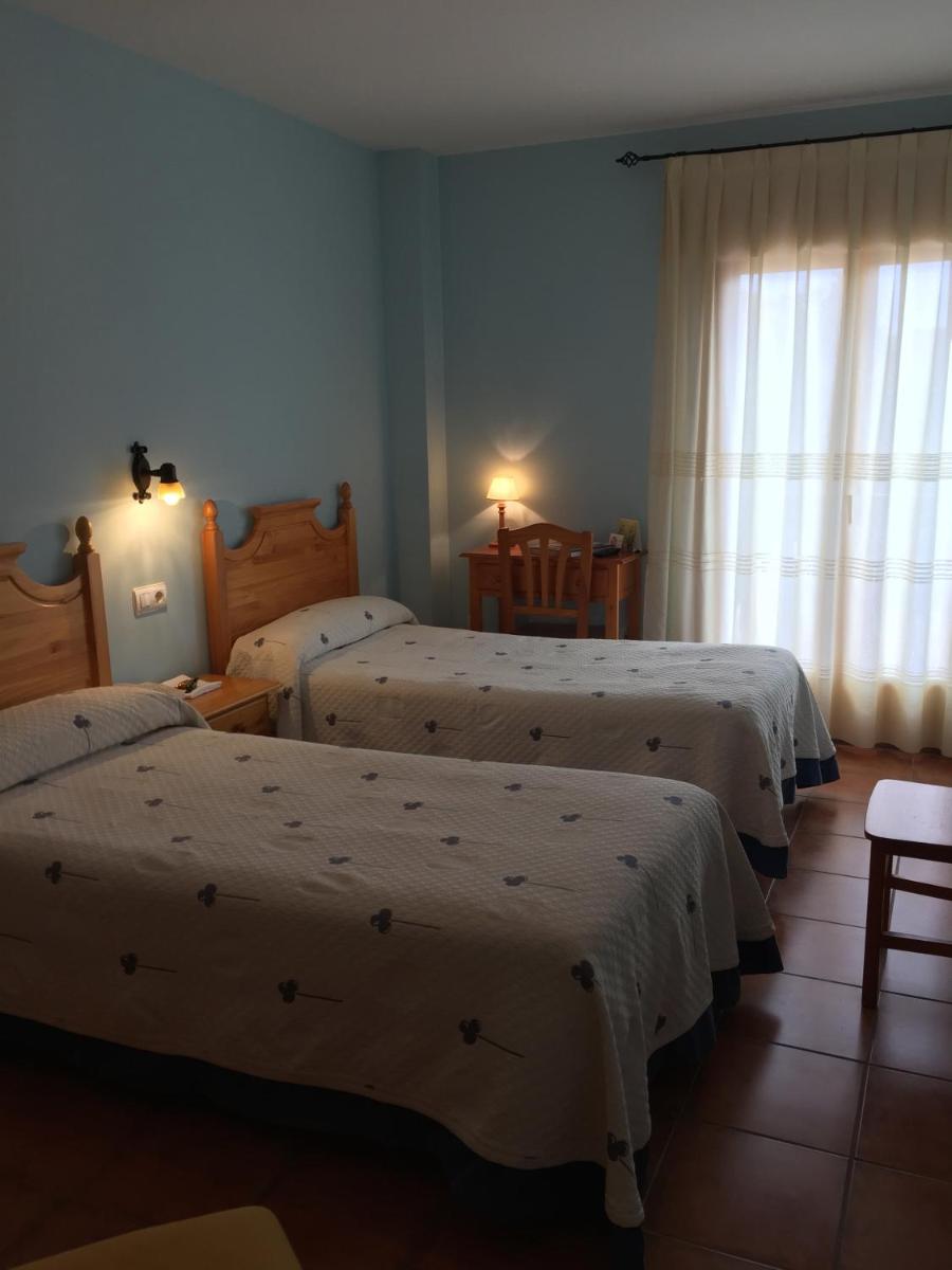 Cama o camas de una habitación en Hotel Castellote