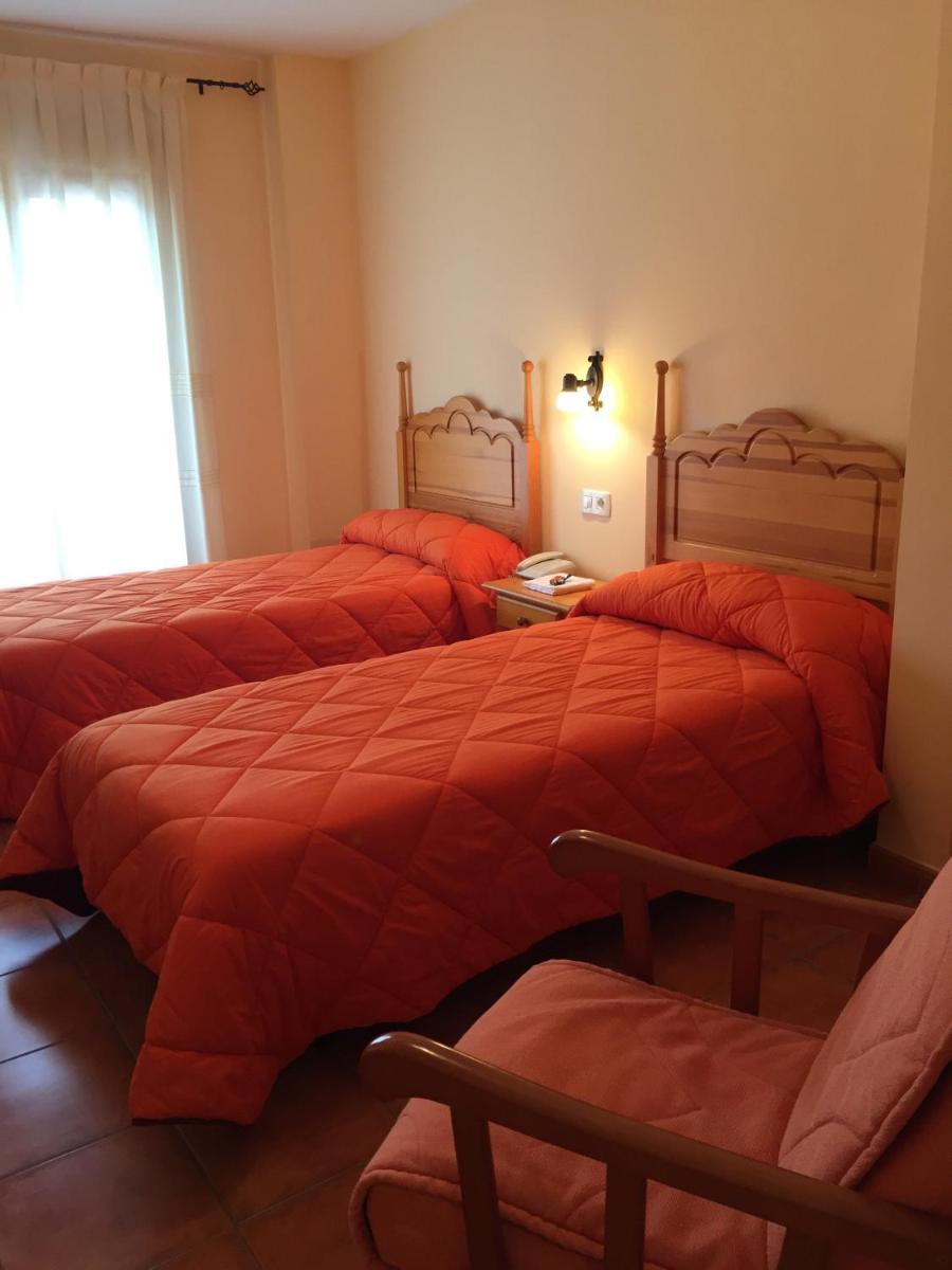 Cama o camas de una habitación en Hotel Castellote