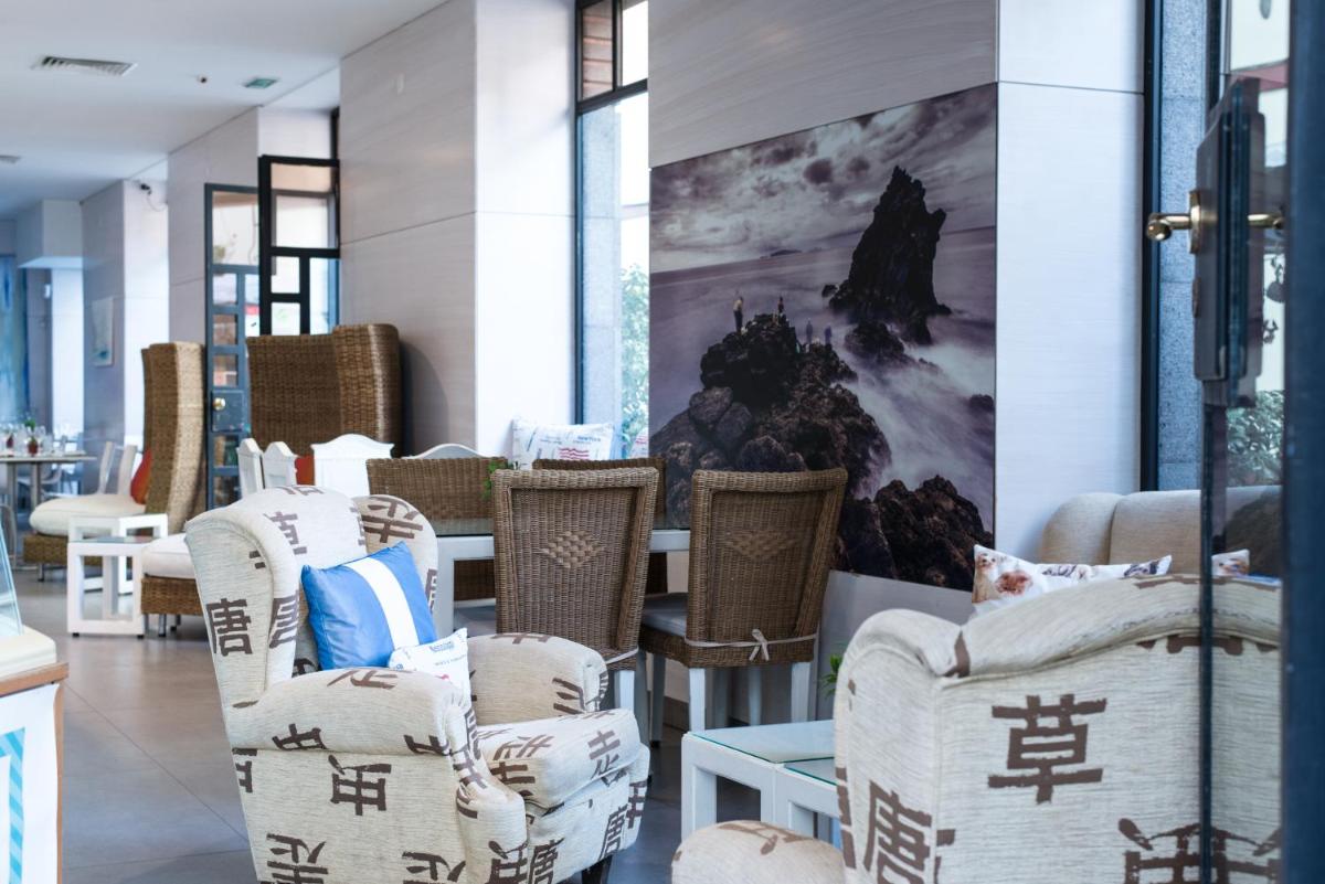 Uma área de estar em Sé Boutique Hotel