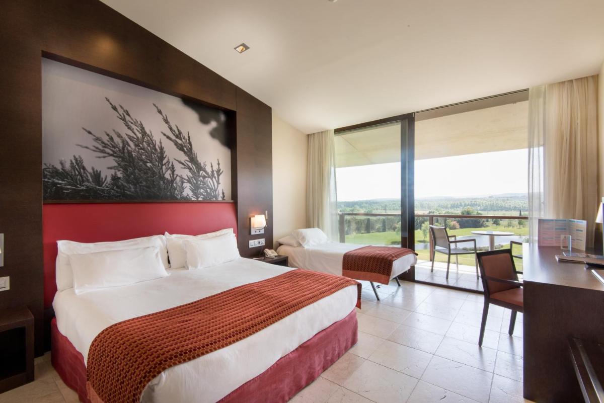 Cama o camas de una habitación en Hotel Mas Solà