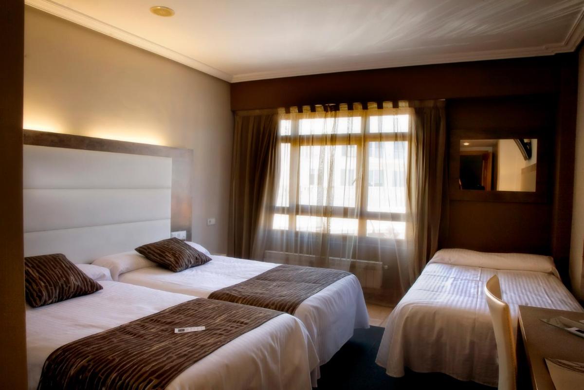 Cama o camas de una habitación en Hotel Spa El Muelle de Suances