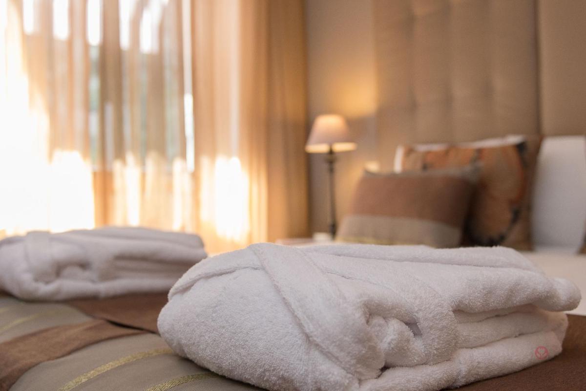 Uma cama ou camas num quarto em Your Hotel & Spa Alcobaça