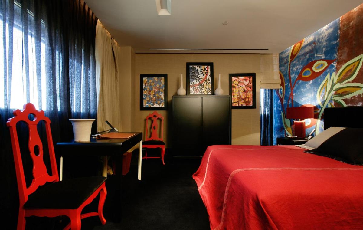 Cama o camas de una habitación en Hotel Puerta America