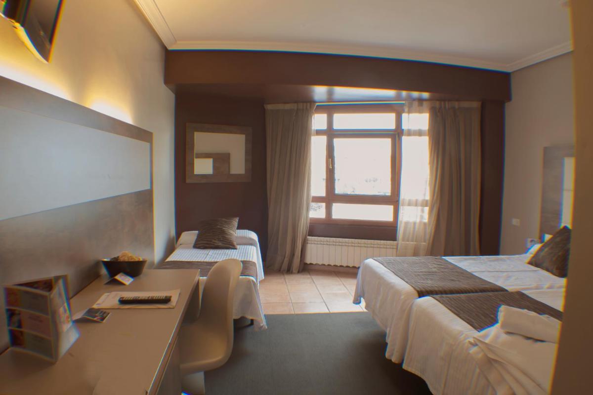 Cama o camas de una habitación en Hotel Spa El Muelle de Suances