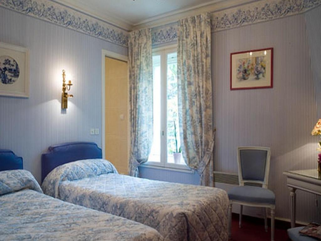Un ou plusieurs lits dans un hébergement de l'établissement Château de Beaulieu et Magnolia Spa, The Originals Relais