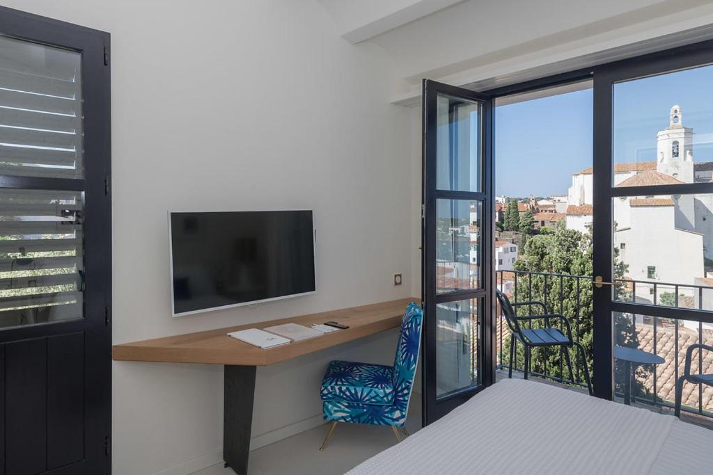Una televisión o centro de entretenimiento en Boutique Hotel Villa Gala by Fimedhotels
