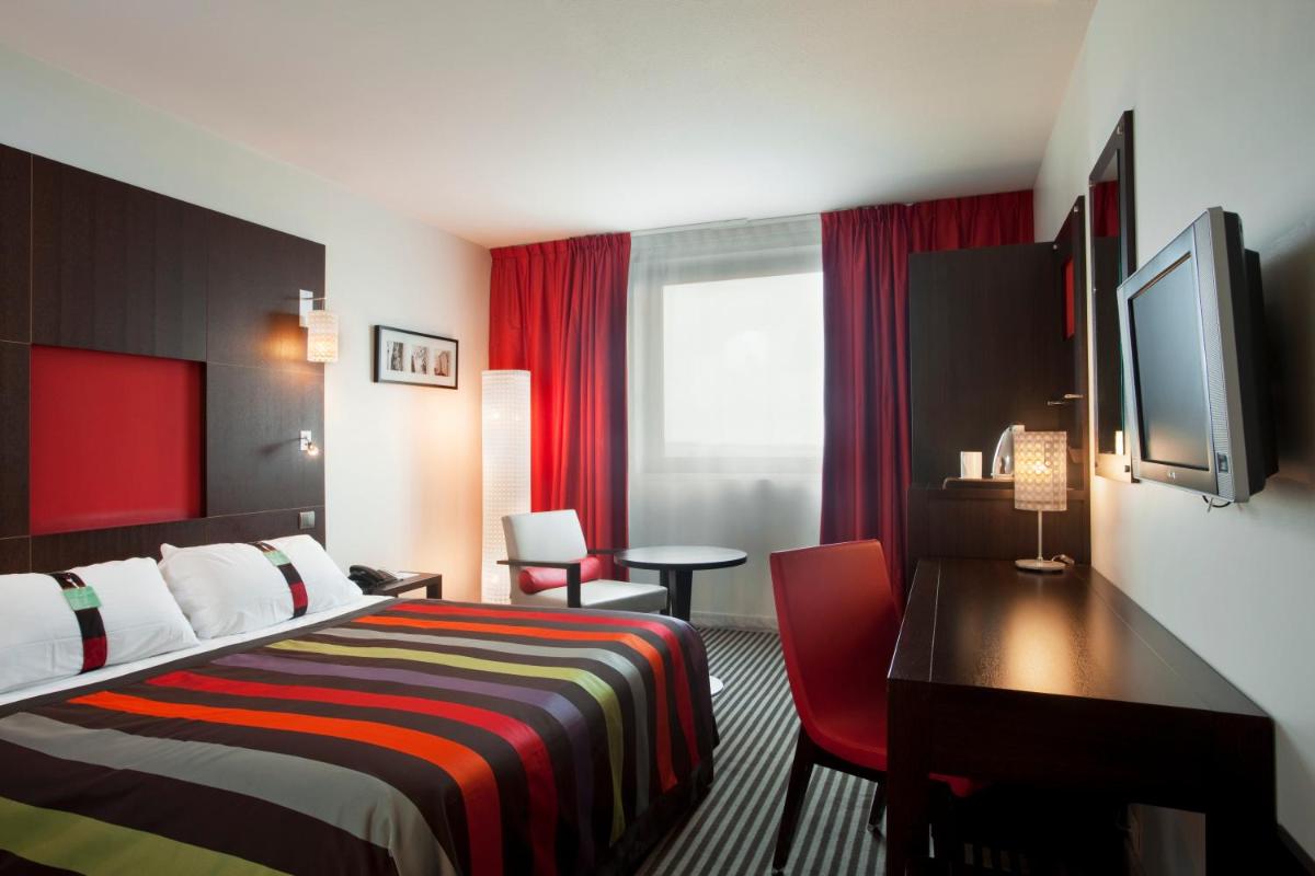 Un ou plusieurs lits dans un hébergement de l'établissement Holiday Inn Dijon Toison D'or by IHG