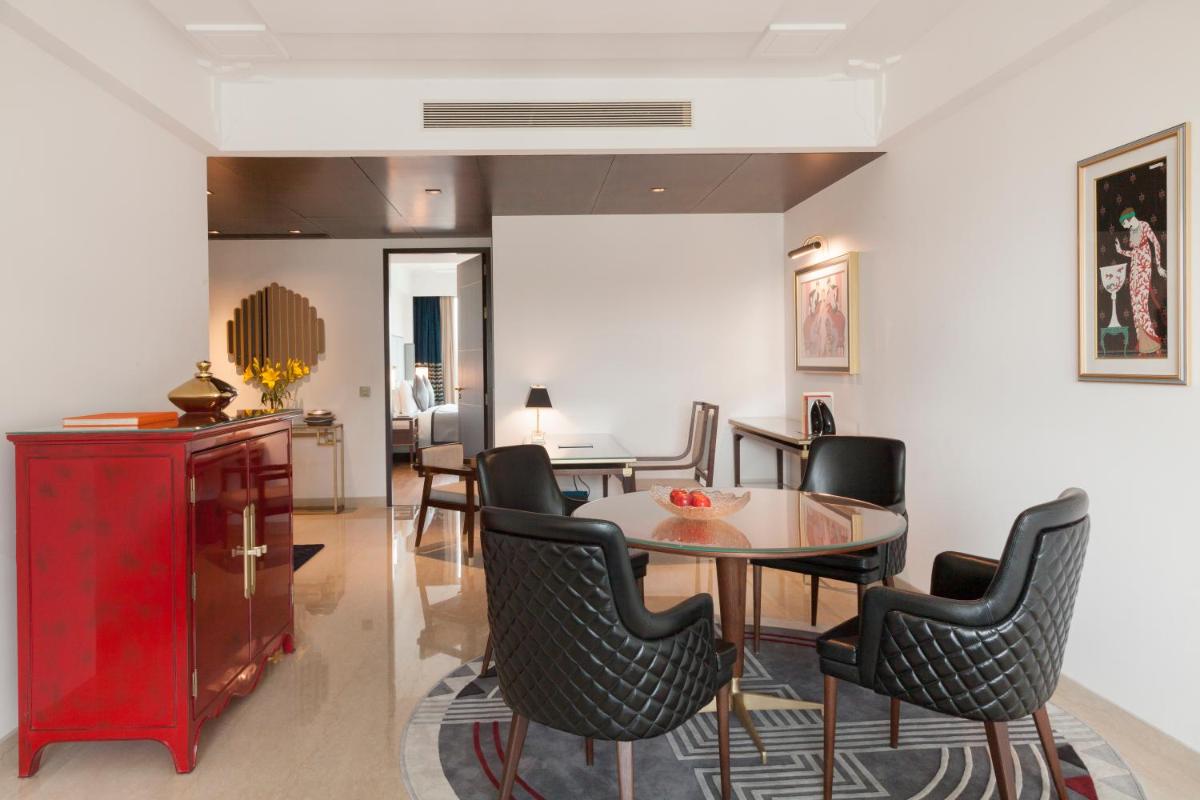 a dining room with a table and chairs at The Oberoi New Delhi in New Delhi a dining room with a table and chairs at The Oberoi New Delhi in New Delhi