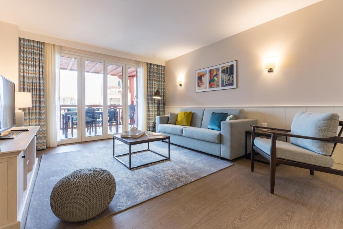 Coin salon dans l'établissement Résidence Pierre & Vacances Premium Presqu'Ile de la Touques