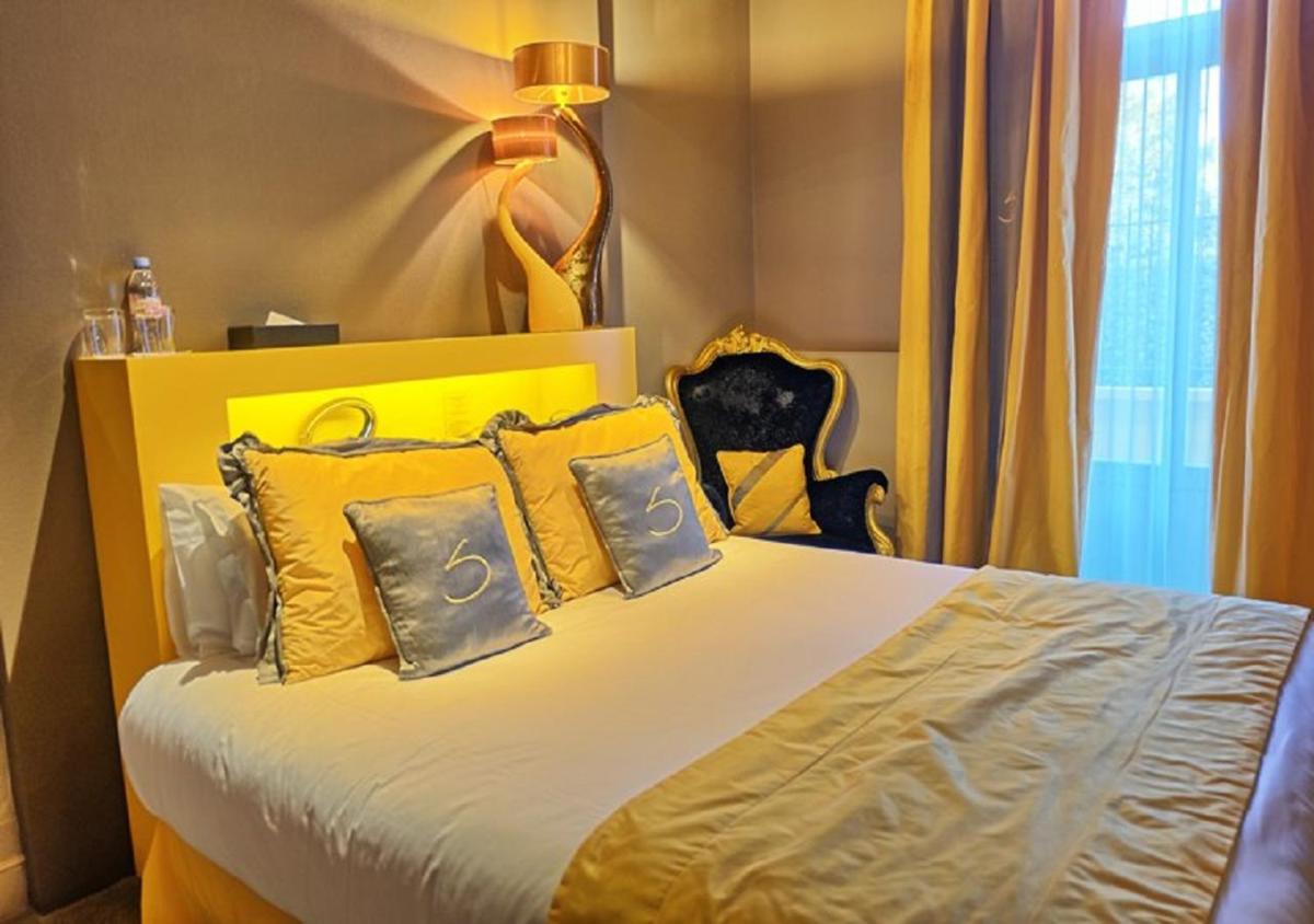 Un ou plusieurs lits dans un hébergement de l'établissement Le Stelsia Resort