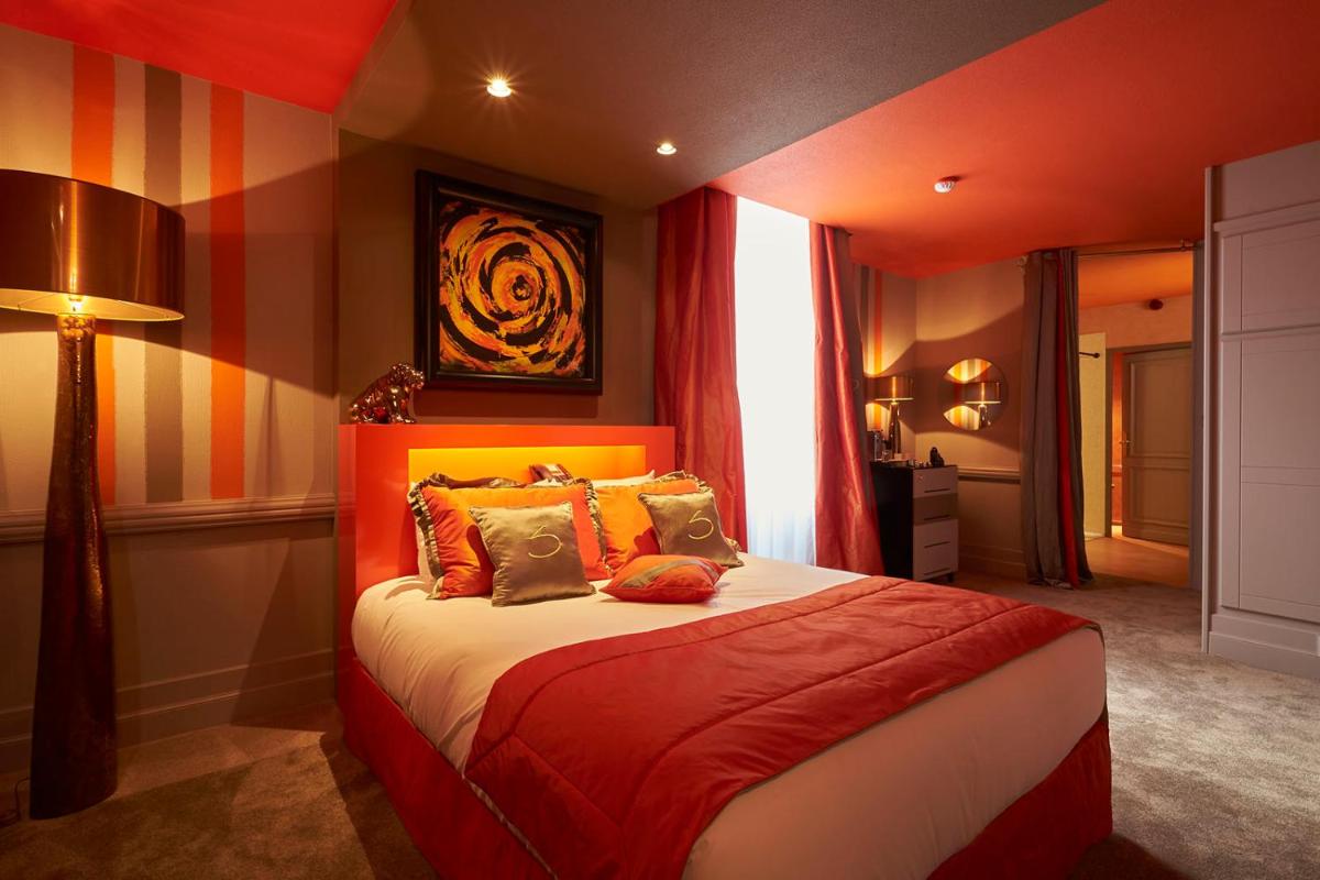 Un ou plusieurs lits dans un hébergement de l'établissement Le Stelsia Resort