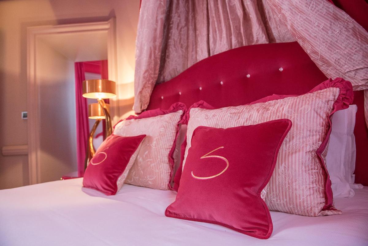 Un ou plusieurs lits dans un hébergement de l'établissement Le Stelsia Resort