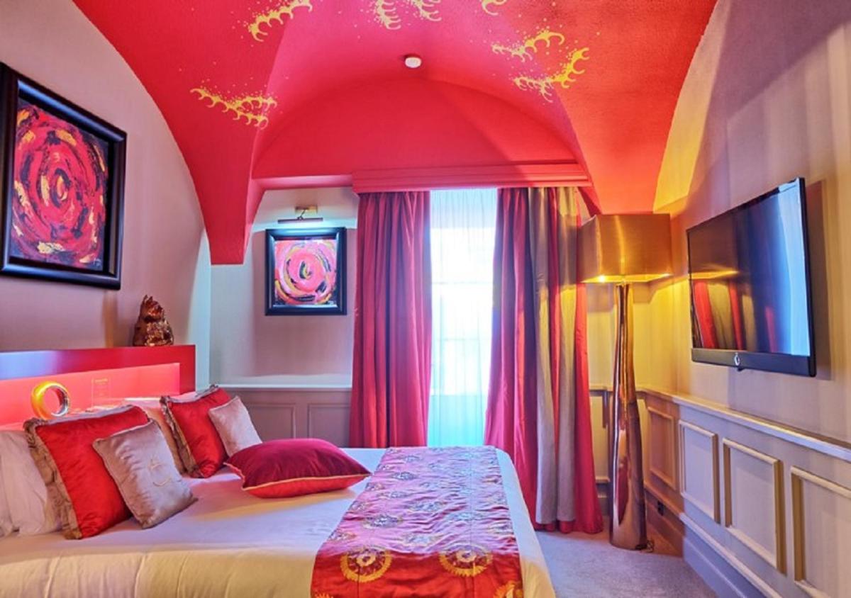 Un ou plusieurs lits dans un hébergement de l'établissement Le Stelsia Resort