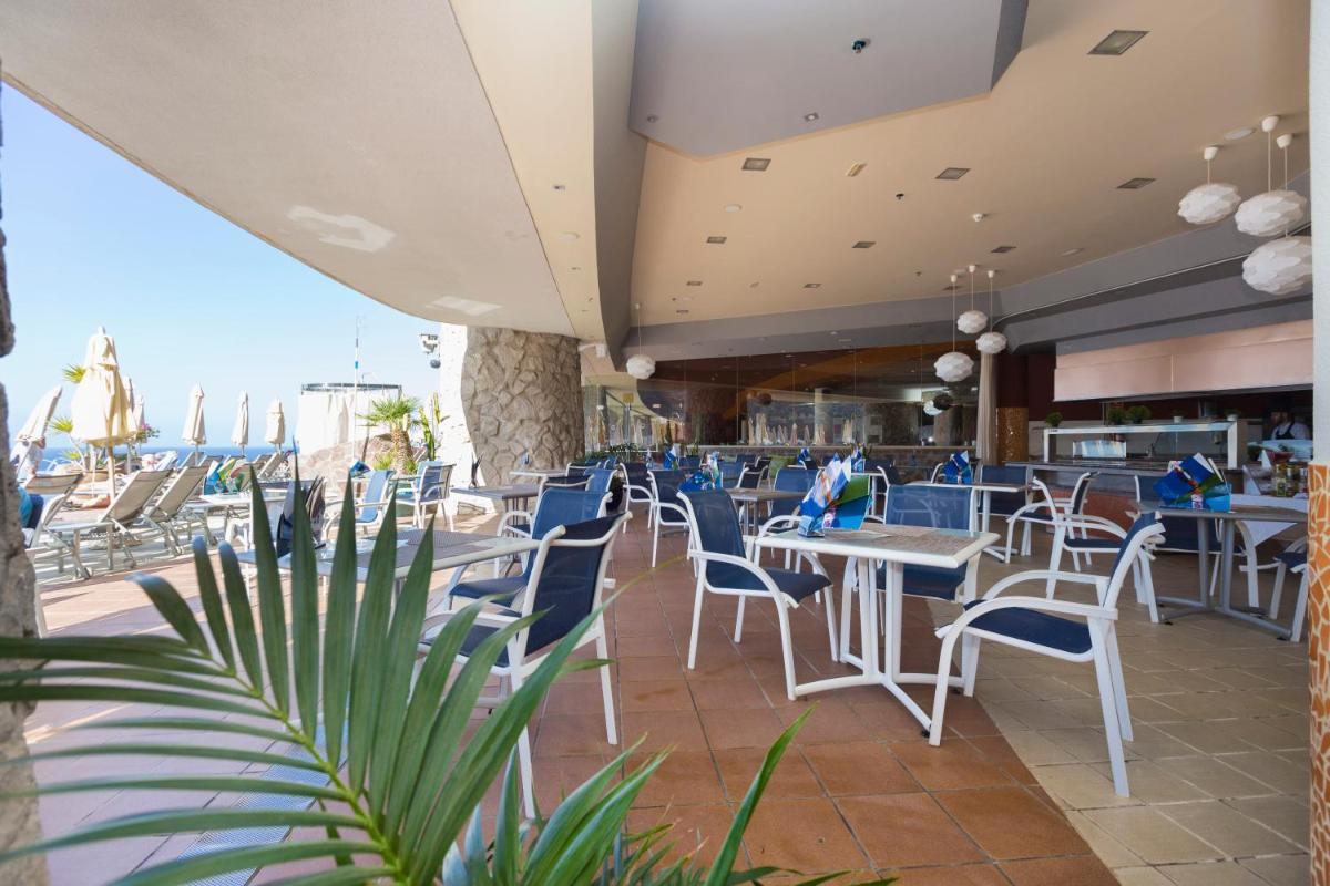 Un restaurante o sitio para comer en Gloria Palace Royal Hotel & Spa