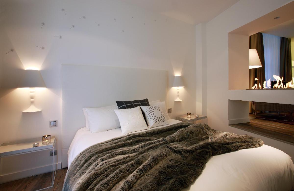 Un ou plusieurs lits dans un hébergement de l'établissement Petit Hôtel Confidentiel