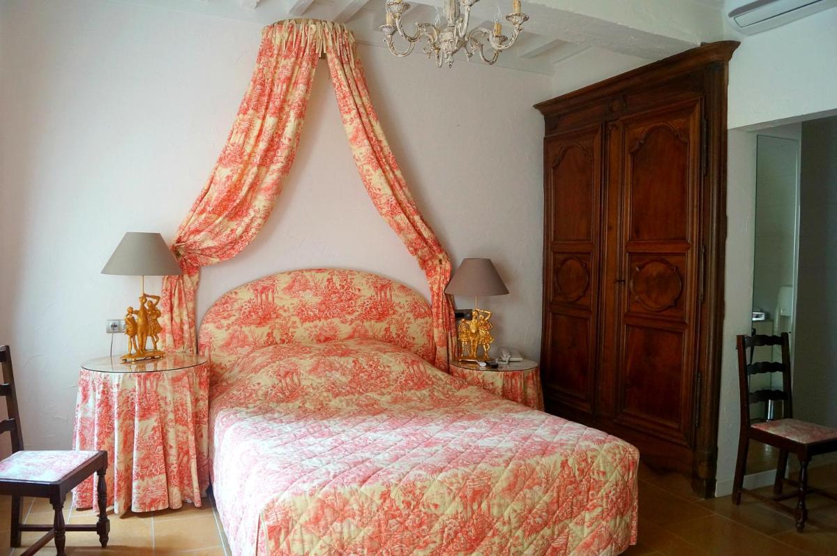 Un ou plusieurs lits dans un hébergement de l'établissement Château de Fleurville & Spa
