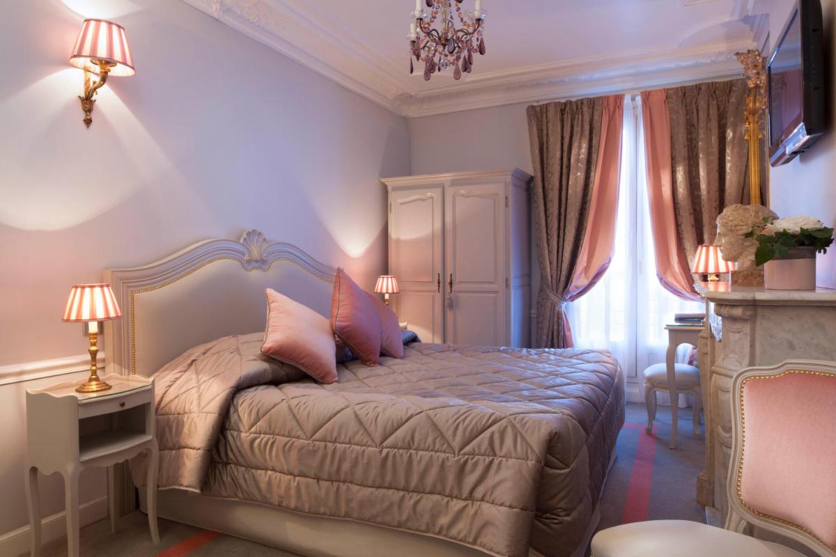 Un ou plusieurs lits dans un hébergement de l'établissement Hotel & Spa Saint-Jacques