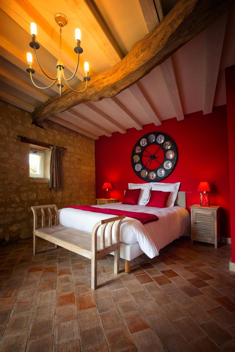 Un ou plusieurs lits dans un hébergement de l'établissement Hôtel & Spa Chai De La Paleine