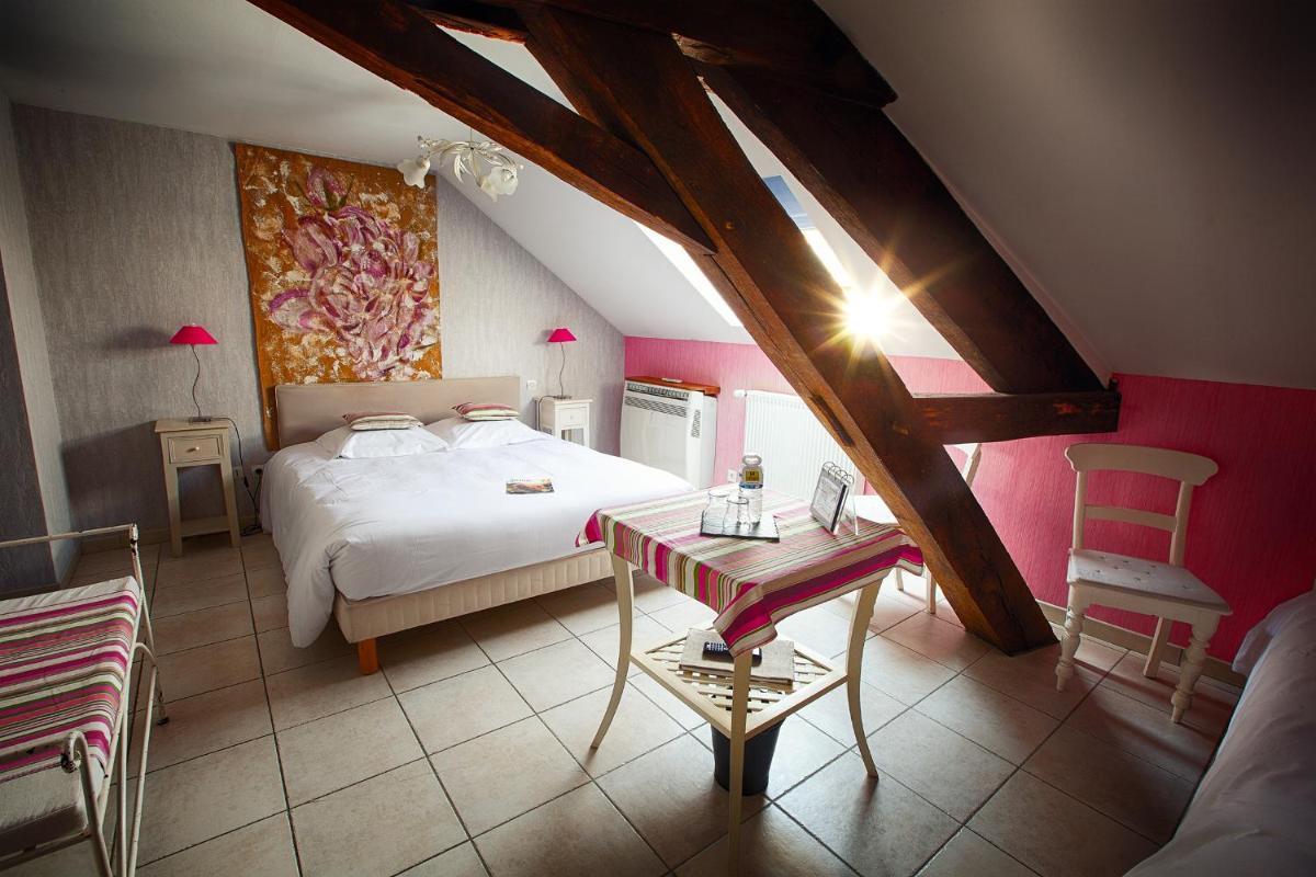 Un ou plusieurs lits dans un hébergement de l'établissement Hôtel & Spa Chai De La Paleine