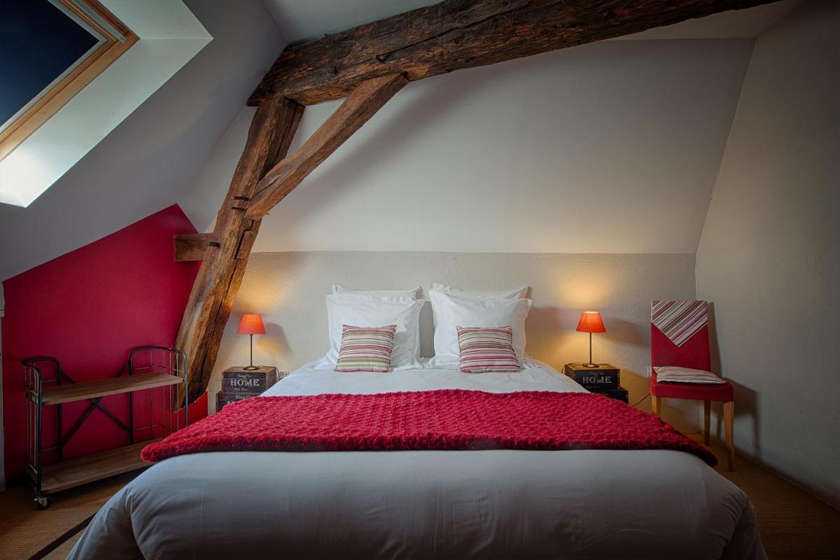 Un ou plusieurs lits dans un hébergement de l'établissement Hôtel & Spa Chai De La Paleine
