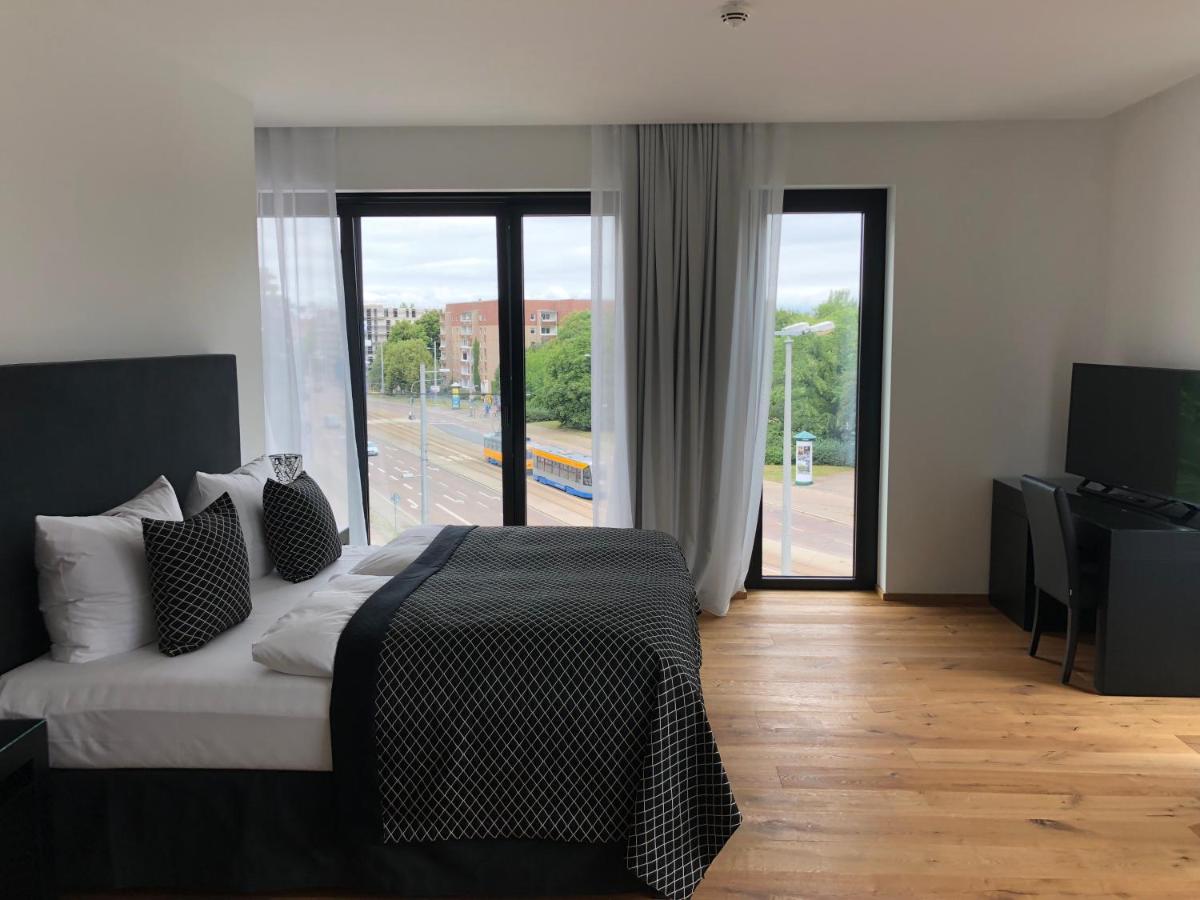 Ein Bett oder Betten in einem Zimmer der Unterkunft Voss Villa Ein Bett oder Betten in einem Zimmer der Unterkunft Voss Villa