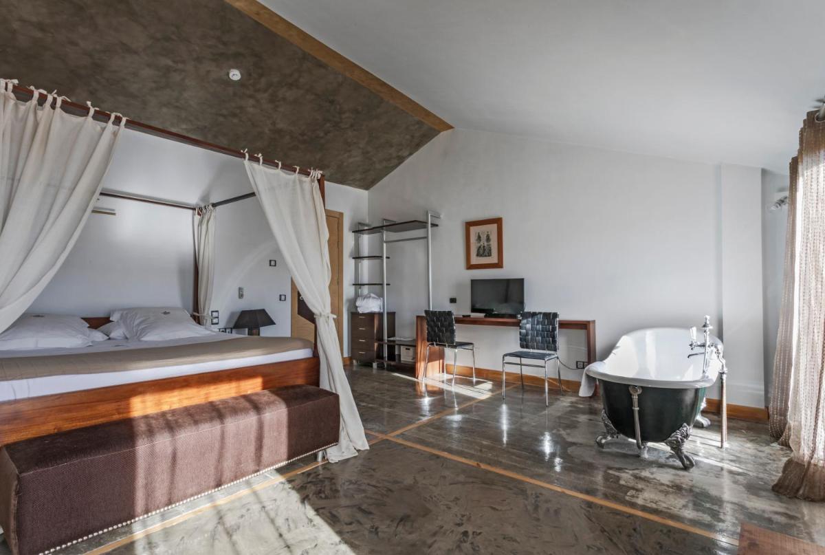 Cama o camas de una habitación en Hotel Casa del Abad