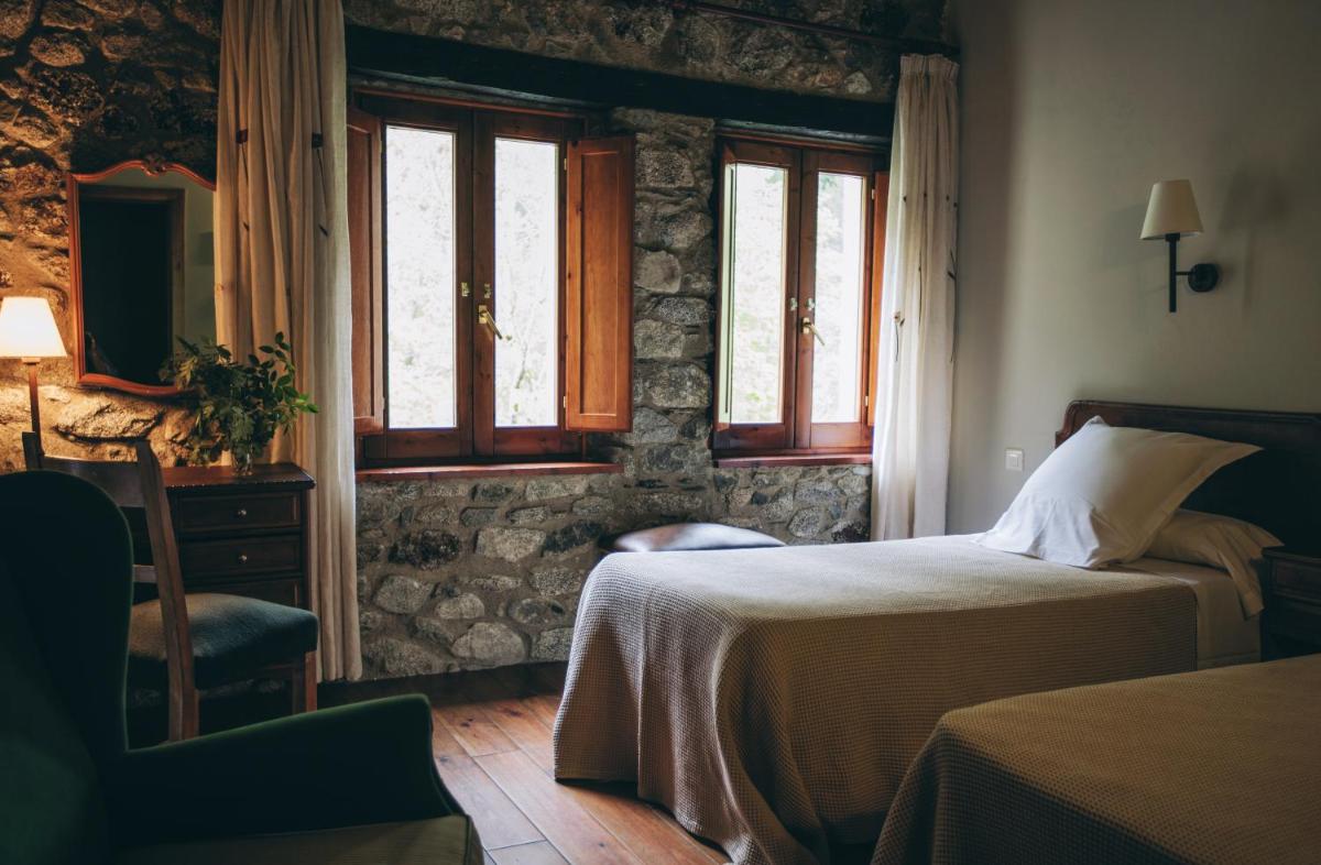 Cama o camas de una habitación en Hotel Caldas