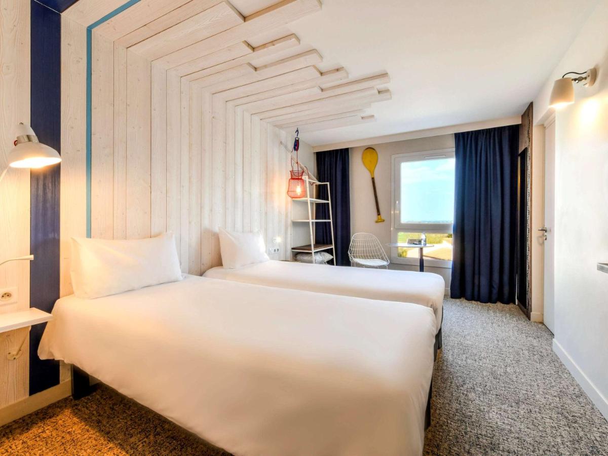 Un ou plusieurs lits dans un hébergement de l'établissement ibis styles La Rochelle Thalasso Chatelaillon