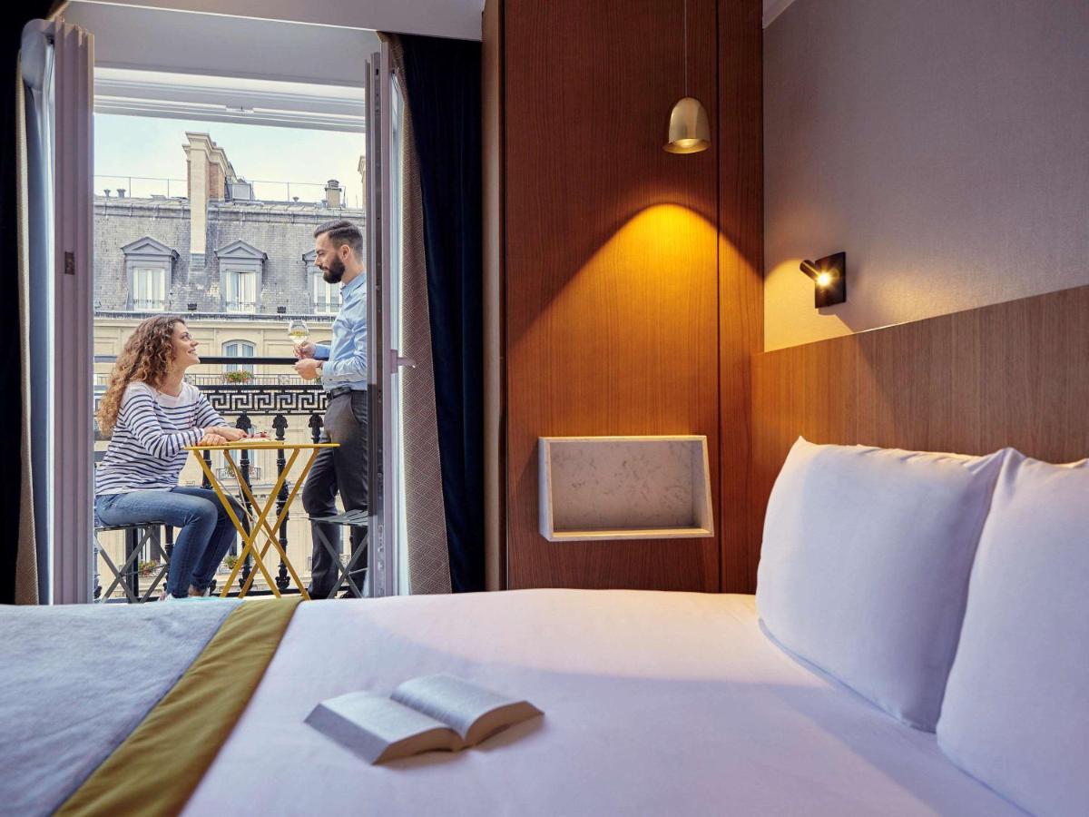 Un ou plusieurs lits dans un hébergement de l'établissement Mercure Paris Opera Garnier Hôtel & Spa