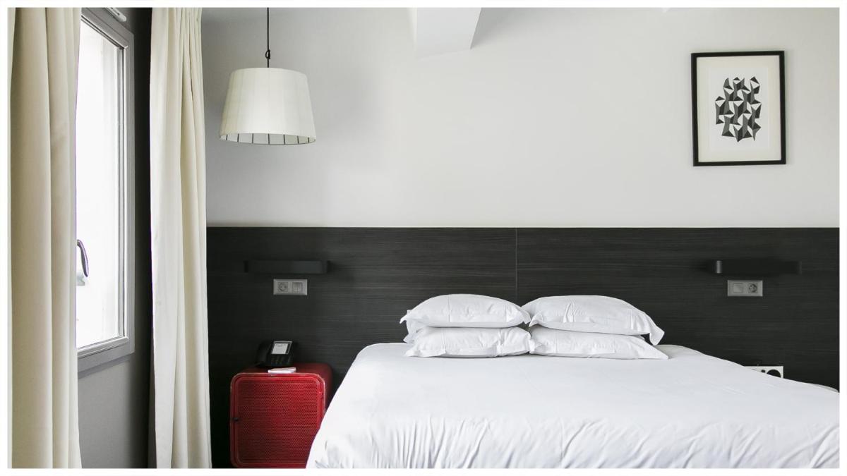 Un ou plusieurs lits dans un hébergement de l'établissement Alex Hotel & Spa