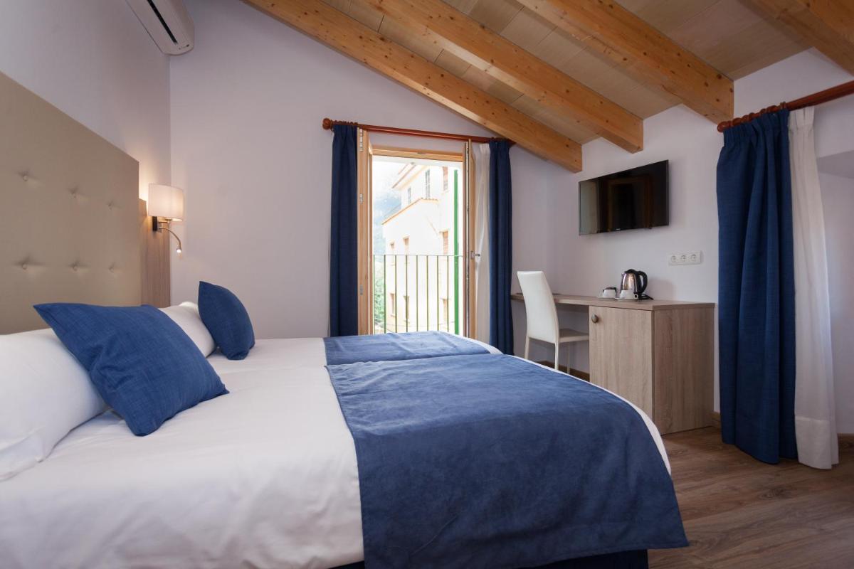 Cama o camas de una habitación en Hotel El Guía
