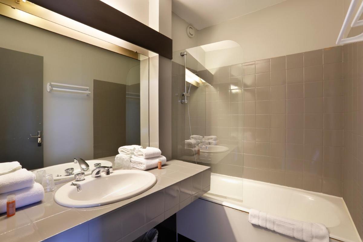 Salle de bains dans l'établissement Altos Hotel & Spa