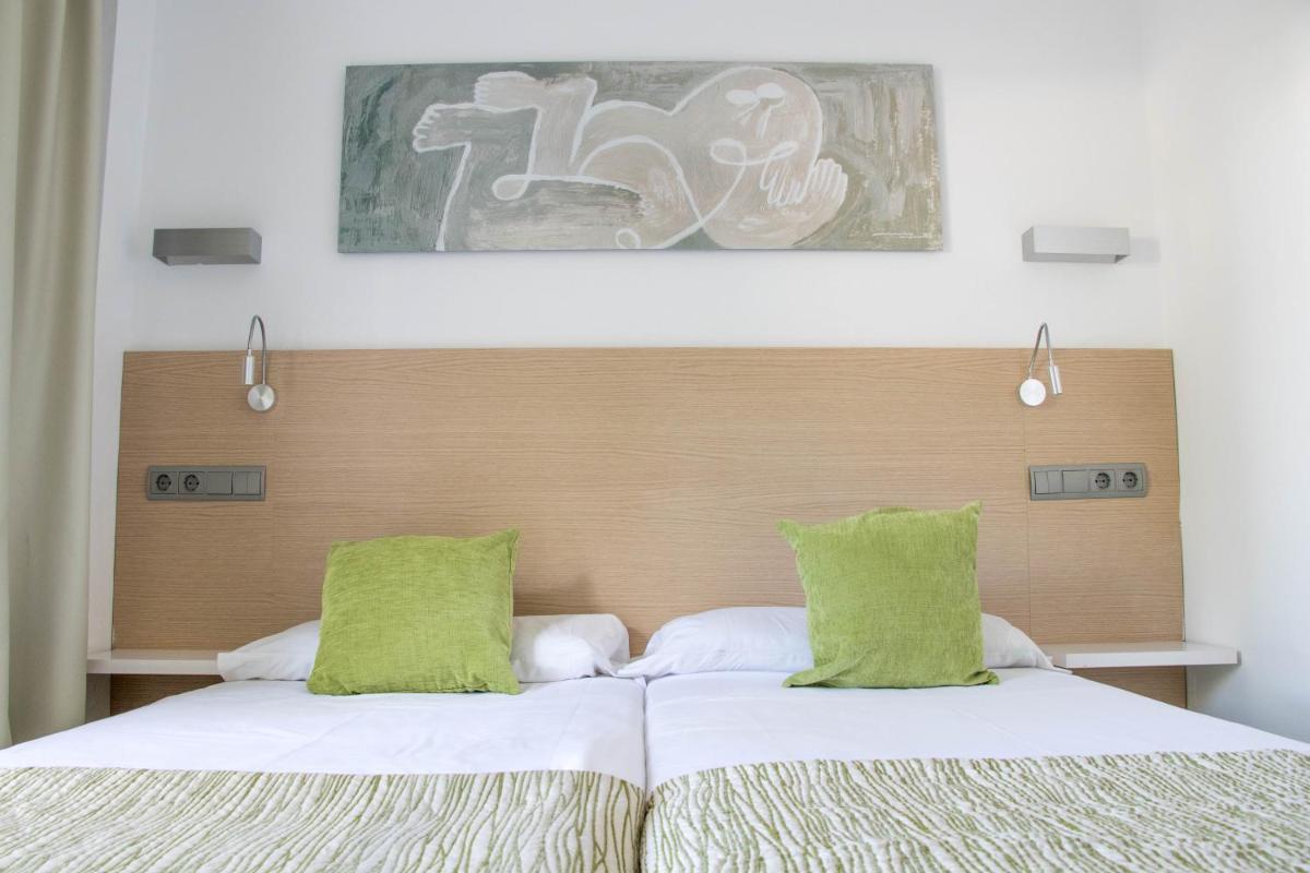 Cama o camas de una habitación en Houm Plaza Son Rigo