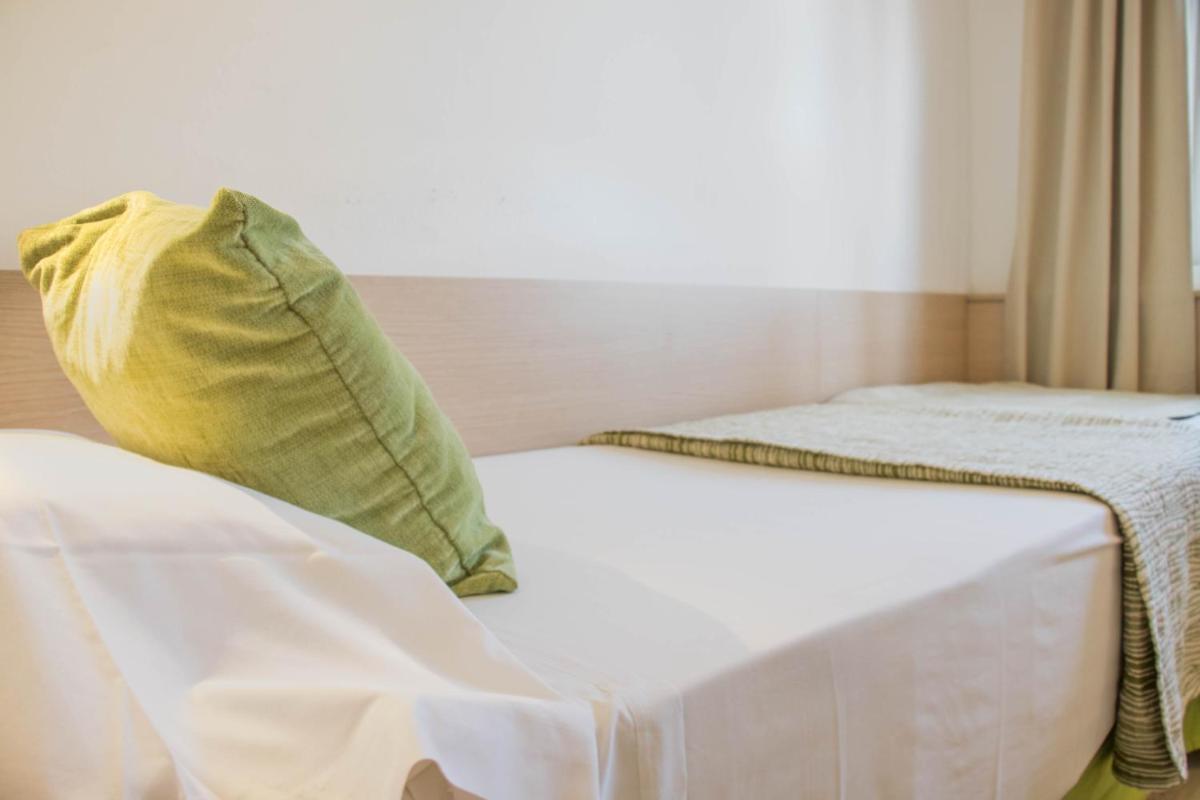 Cama o camas de una habitación en Houm Plaza Son Rigo