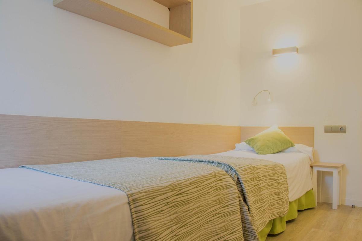 Cama o camas de una habitación en Houm Plaza Son Rigo