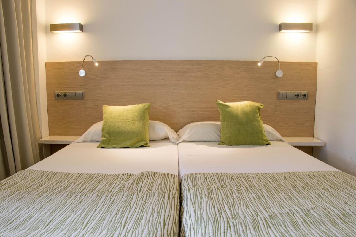 Cama o camas de una habitación en Houm Plaza Son Rigo