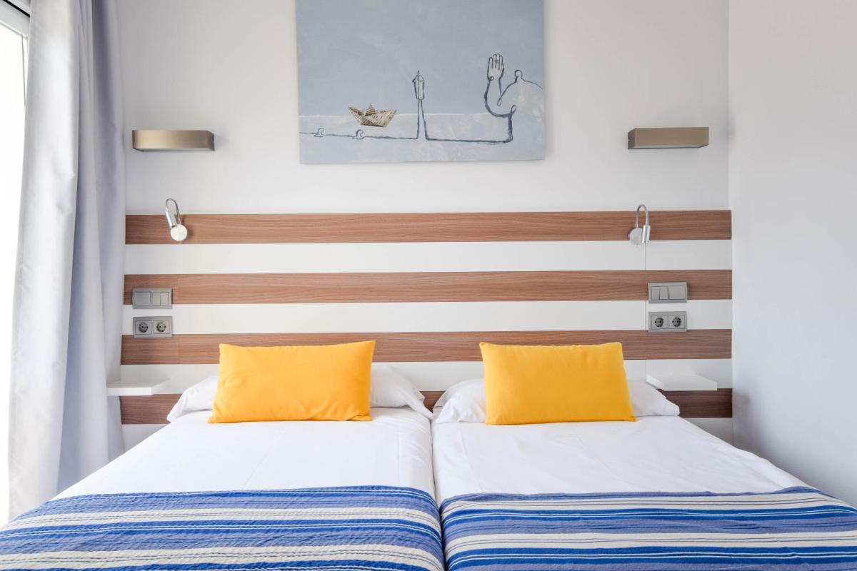 Cama o camas de una habitación en Houm Plaza Son Rigo