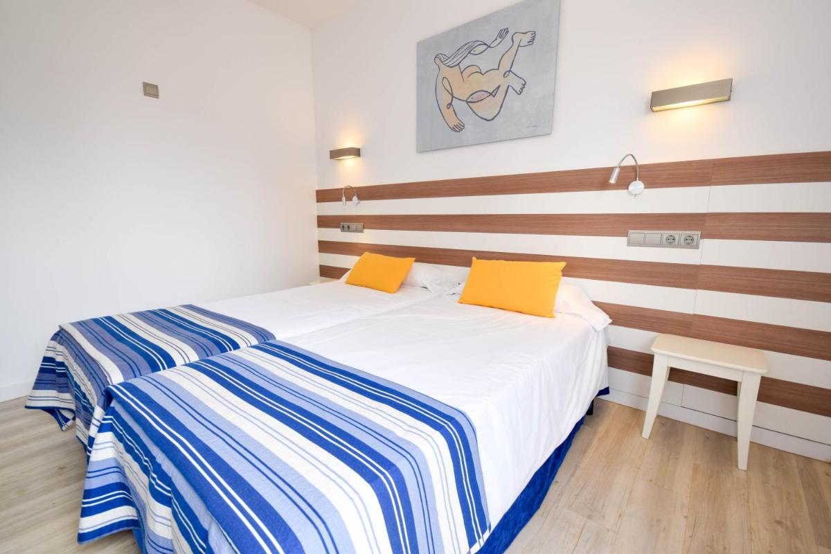 Cama o camas de una habitación en Houm Plaza Son Rigo