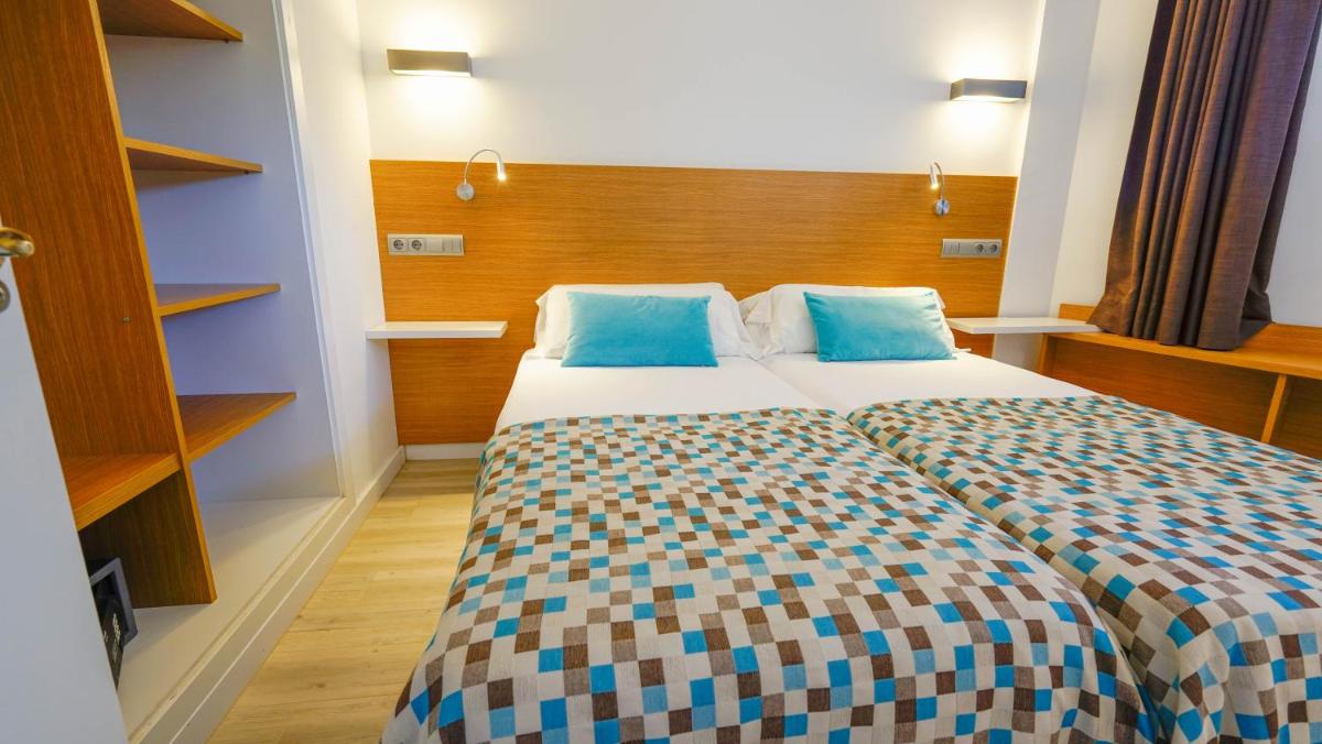 Cama o camas de una habitación en Houm Plaza Son Rigo