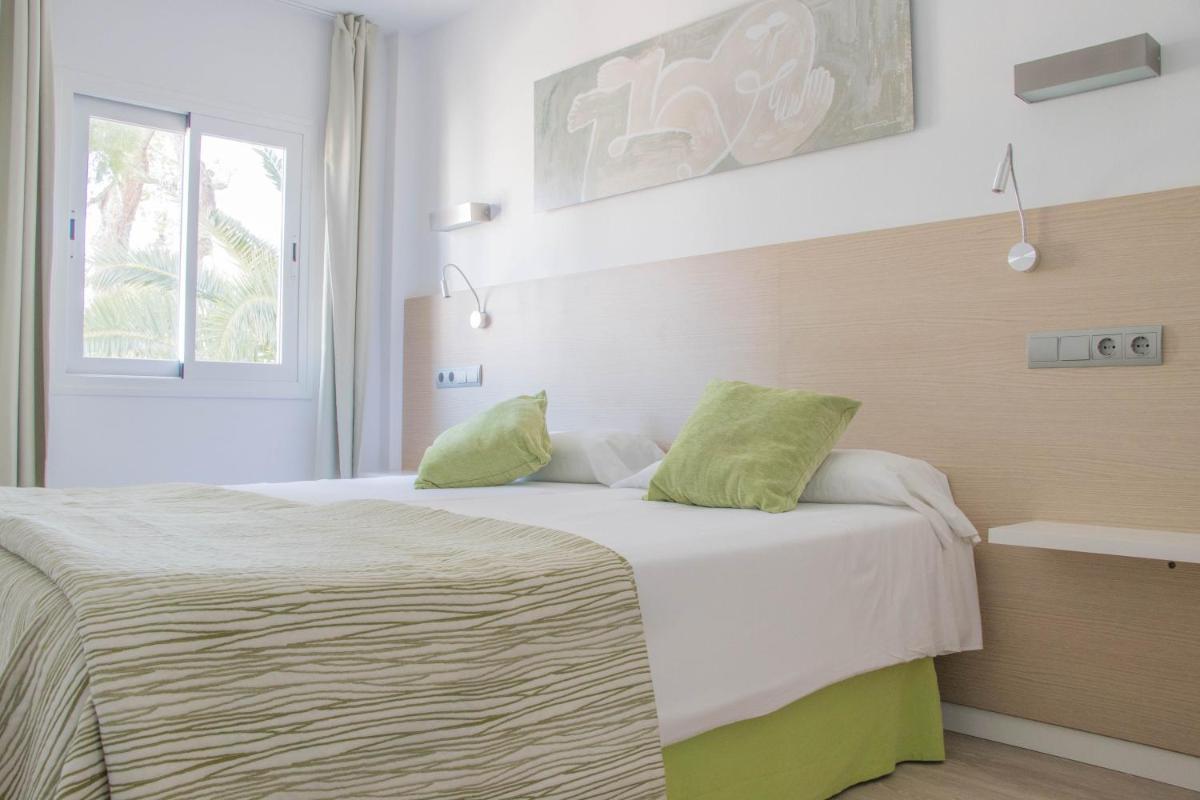 Cama o camas de una habitación en Houm Plaza Son Rigo