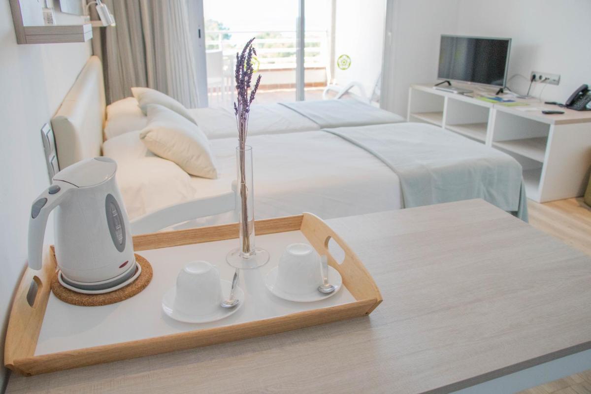 Cama o camas de una habitación en Houm Plaza Son Rigo