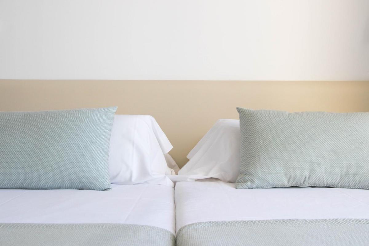 Cama o camas de una habitación en Houm Plaza Son Rigo