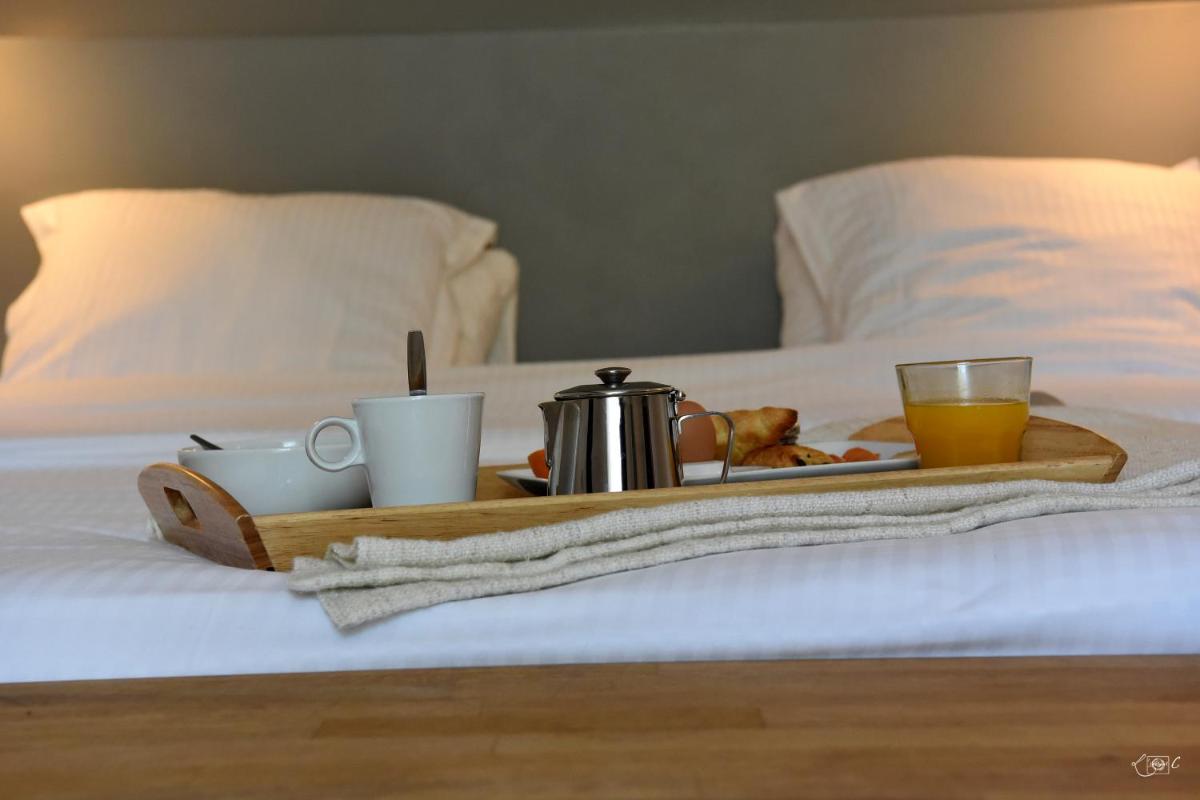 Un ou plusieurs lits dans un hébergement de l'établissement Le Domaine de Baulieu, Singuliers Hotels