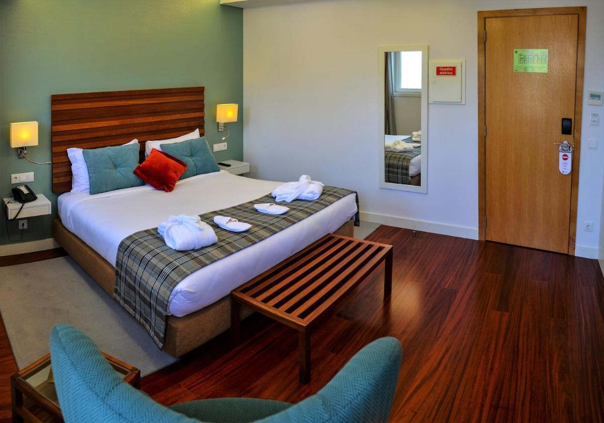 Uma cama ou camas num quarto em Hotel São Bento da Porta Aberta & Spa
