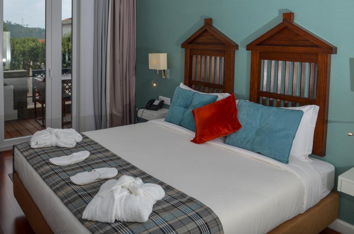 Uma cama ou camas num quarto em Hotel São Bento da Porta Aberta & Spa