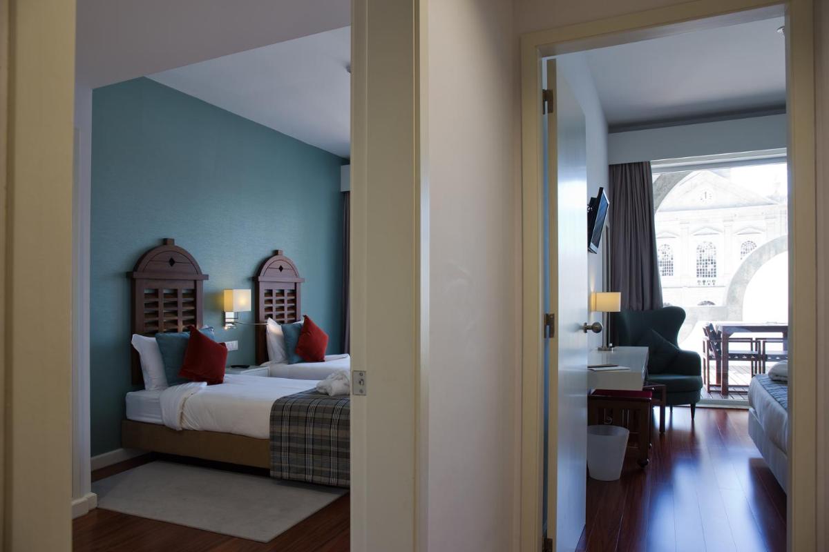 Uma cama ou camas num quarto em Hotel São Bento da Porta Aberta & Spa