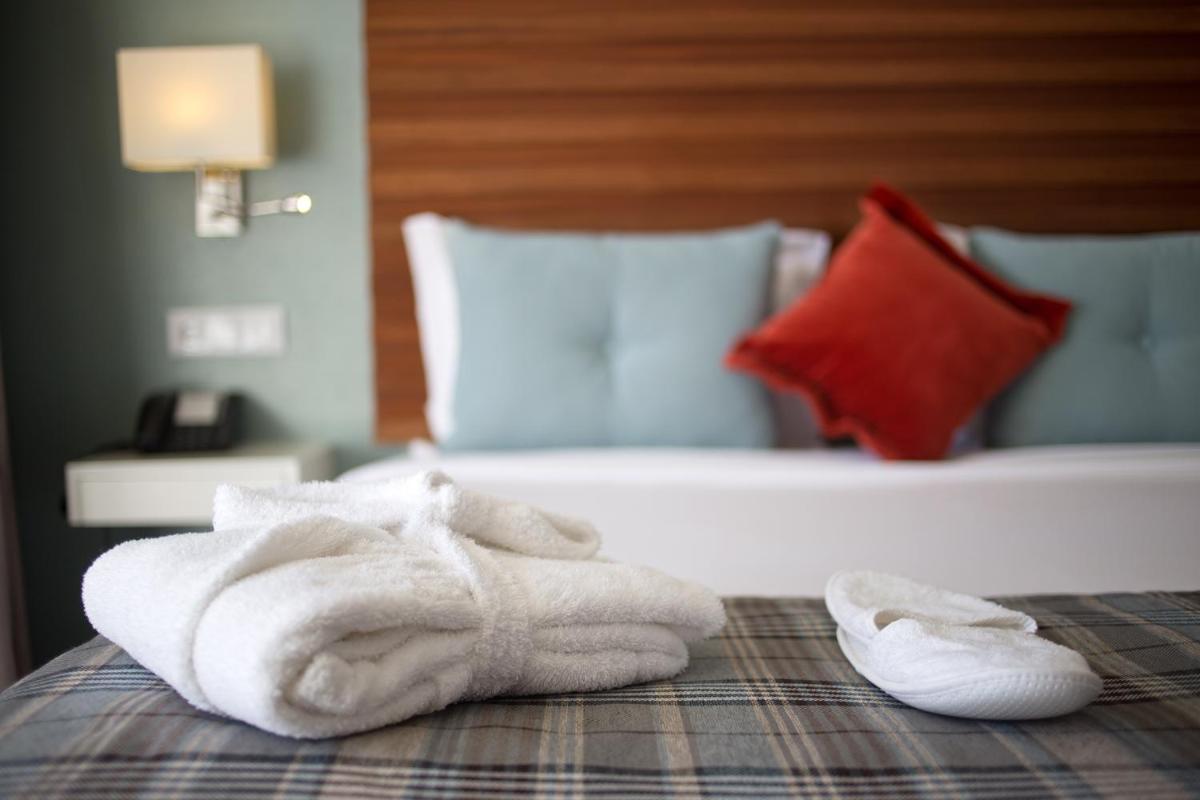 Uma cama ou camas num quarto em Hotel São Bento da Porta Aberta & Spa