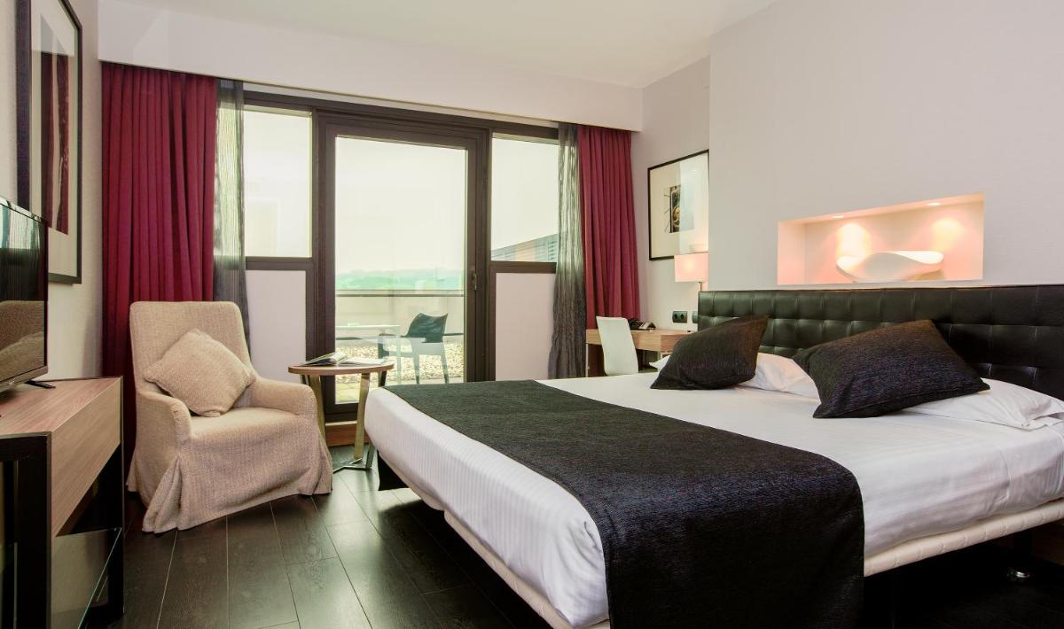 Cama o camas de una habitación en URH Hotel Spa Zen Balagares