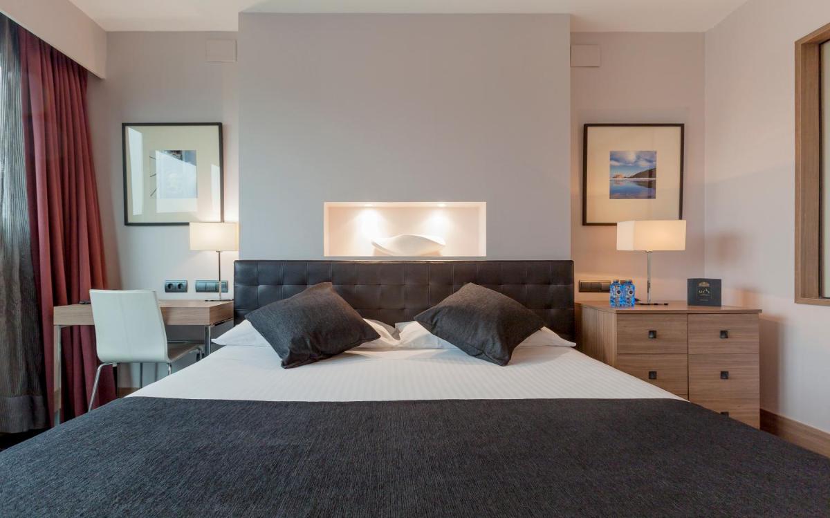 Cama o camas de una habitación en URH Hotel Spa Zen Balagares